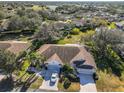 Aerial view showcasing villa, community, and surrounding landscape at 1006 Mcdaniel St # 21, Sun City Center, FL 33573