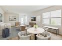 Bright and airy living room with a dining area and plenty of natural light at 10264 Kalamazoo Pl, Parrish, FL 34219