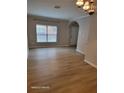 Spacious living room with large window and hardwood floors at 1028 Tullamore Dr, Wesley Chapel, FL 33543