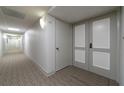Building hallway with carpet and neutral walls at 1460 Gulf Blvd # 811, Clearwater Beach, FL 33767