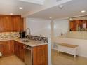 Updated kitchen with wood cabinets and stainless steel appliances at 1460 Gulf Blvd # 811, Clearwater Beach, FL 33767