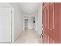 Interior entryway with tile flooring and doors to other rooms at 15571 Stone House Dr, Brooksville, FL 34604