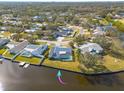 Bird's eye view showcasing home's waterfront location and pool at 1944 Arvis E Cir, Clearwater, FL 33764