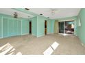 Bright living room with a glass slider and neutral colors at 215 Druid Hills Rd, Temple Terrace, FL 33617