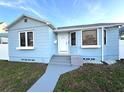 Charming light blue house with white trim, steps, and walkway at 2720 9Th N Ave, St Petersburg, FL 33713