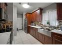 Modern kitchen with stainless steel appliances and quartz countertops at 305 E Hanlon St, Tampa, FL 33604