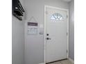 Front door entryway with key hook and decorative sign at 3327 Fox Hunt Dr, Palm Harbor, FL 34683