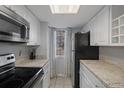 Efficient kitchen features stainless steel appliances and granite countertops at 3327 Fox Hunt Dr, Palm Harbor, FL 34683