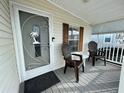 Front porch with two chairs and a small table at 34071 Avocado N Dr, Pinellas Park, FL 33781