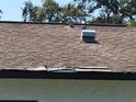 Image shows a damaged roof with missing shingles at 3445 10Th N Ave, St Petersburg, FL 33713