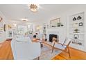 Bright living room with a fireplace, hardwood floors, and comfortable seating at 425 20Th Ne Ave, St Petersburg, FL 33704