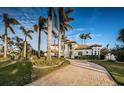 Beautiful two-story home with palm trees and a long driveway at 4419 Bayshore Ne Blvd, St Petersburg, FL 33703