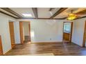 Living room with wood flooring and exposed beams at 616 2Nd Nw Ave, Largo, FL 33770