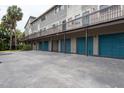 Two-story building with private garages and parking at 6325 Newtown Cir # 25B2, Tampa, FL 33615