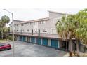 Two-story building with private garages and parking at 6325 Newtown Cir # 25B2, Tampa, FL 33615