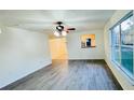 Spacious living area with grey laminate wood flooring and large windows at 7117 50Th E Ave, Palmetto, FL 34221