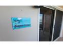 Dolphin Lounge balcony entrance sign at 7700 Sun Island S Dr # 702, South Pasadena, FL 33707