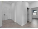 Bright foyer with tile flooring, and doors to other rooms at 2009 Gardenia Ave, Port Charlotte, FL 33953