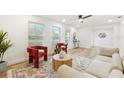 Modern living room featuring a comfortable sofa and accent chairs at 2181 Wateroak N Dr, Clearwater, FL 33764