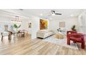 Bright and airy living room with hardwood floors and stylish furniture at 2181 Wateroak N Dr, Clearwater, FL 33764
