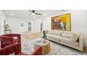 Spacious living area with light colored sofa and hardwood floors at 2181 Wateroak N Dr, Clearwater, FL 33764