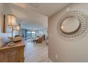 View through entryway showcasing living room and water view at 240 Sand Key Estates Dr # 213, Clearwater, FL 33767
