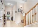 Light and bright entry hall with staircase and storage at 310 Summer Clouds Pl, Brandon, FL 33511