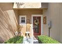 Inviting entryway with red door, wreath, and welcome decor at 310 Summer Clouds Pl, Brandon, FL 33511