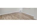 Light wood laminate flooring in a living area at 4504 S Cameron Ave, Tampa, FL 33611