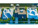 An aerial view showcasing a home's roofline and its location on a waterway at 615 Mirabay Blvd, Apollo Beach, FL 33572