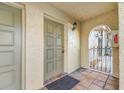 Charming condo entrance featuring a textured front door, tiled floor, and covered entryway at 6262 142Nd N Ave # 603, Clearwater, FL 33760