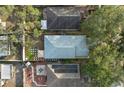 Top-down view of the house, showcasing the backyard with patio and solar panels at 10208 Lakeside Vista Dr, Riverview, FL 33569