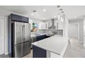 Modern kitchen featuring stainless steel appliances and a breakfast bar at 1204 Dartmouth Dr, Bradenton, FL 34207
