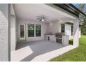 Covered patio features a built-in grill and sink at 13458 Haflinger Way, Hudson, FL 34667