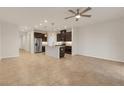 Open concept kitchen and living room with tile floors at 18909 Ulmus St, Lutz, FL 33558