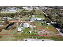 Aerial view of commercial property with large lot and outbuildings at 2601 11Th Se Ave, Ruskin, FL 33570