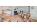 Living room with hardwood floors, open to kitchen at 27466 Us Highway 19 N # 78, Clearwater, FL 33761