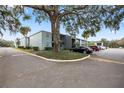 Building exterior showcasing landscaping and parking area at 2835 Somerset Park Dr # 103, Tampa, FL 33613