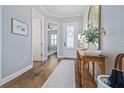 Bright entryway with wood flooring, console table, and view to other rooms at 6224 S Main Ave, Tampa, FL 33611