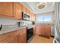 Light and bright kitchen featuring stainless steel appliances and lovely granite countertops at 90 S Highland Ave # 1306, Tarpon Springs, FL 34689