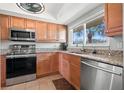 This well-lit kitchen features stainless steel appliances and lovely granite countertops at 90 S Highland Ave # 1306, Tarpon Springs, FL 34689