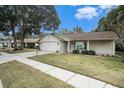 Charming ranch home with a spacious front yard and driveway at 10504 Tapestry Dr, Port Richey, FL 34668