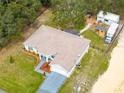Aerial view showing the house, yard, and a motor home at 11421 Petrel Ave, Weeki Wachee, FL 34614