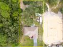 House and lot aerial view, showing surrounding land at 11421 Petrel Ave, Weeki Wachee, FL 34614