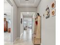 Bright entryway with tile floor and built-in bench at 15720 Buckford Landing Pl, Sun City Center, FL 33573