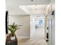 Bright condo entryway with modern decor and hardwood floors at 16750 Gulf Blvd # 413, North Redington Beach, FL 33708