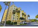 Beach condo building with parking and lush landscaping at 16750 Gulf Blvd # 413, North Redington Beach, FL 33708
