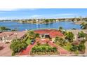 Luxury waterfront home with red tile roof and circular driveway at 1818 Dolphin S Blvd, St Petersburg, FL 33707