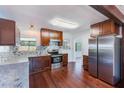 Modern kitchen with stainless steel appliances and granite countertops at 21 Belle Meade Cir, Largo, FL 33770