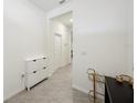 Clean hallway with tile floors and access to other rooms at 32241 Turtle Grace Loop, Wesley Chapel, FL 33545